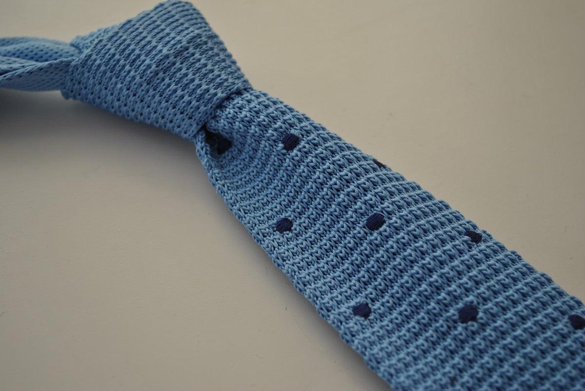 light blue skinny knitted tie with dark blue polka dots