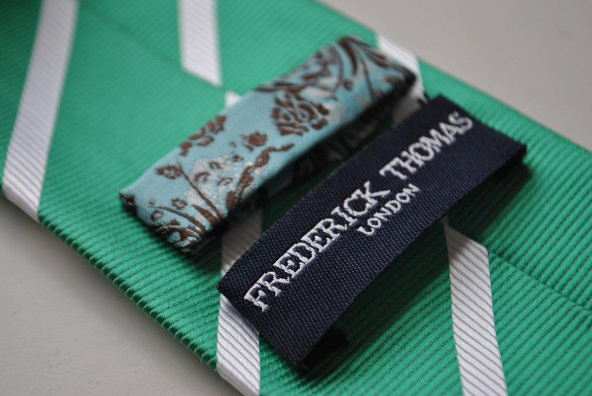 green tie with white club stripes