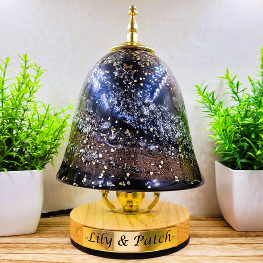 Ashes in glass table lamp