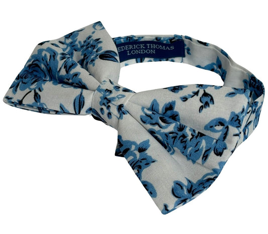 ivory cotton bow tie with blue rose design and matching pocket square