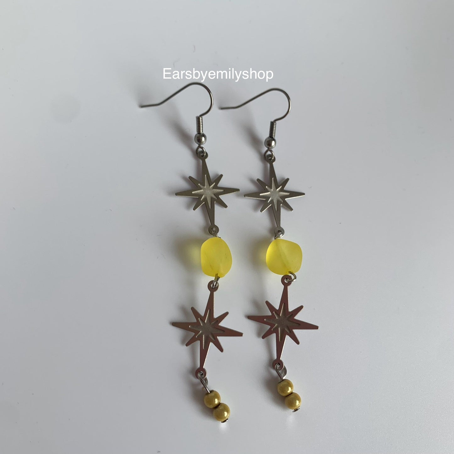 Stainless steel star and yellow bead statement dangle earrings
