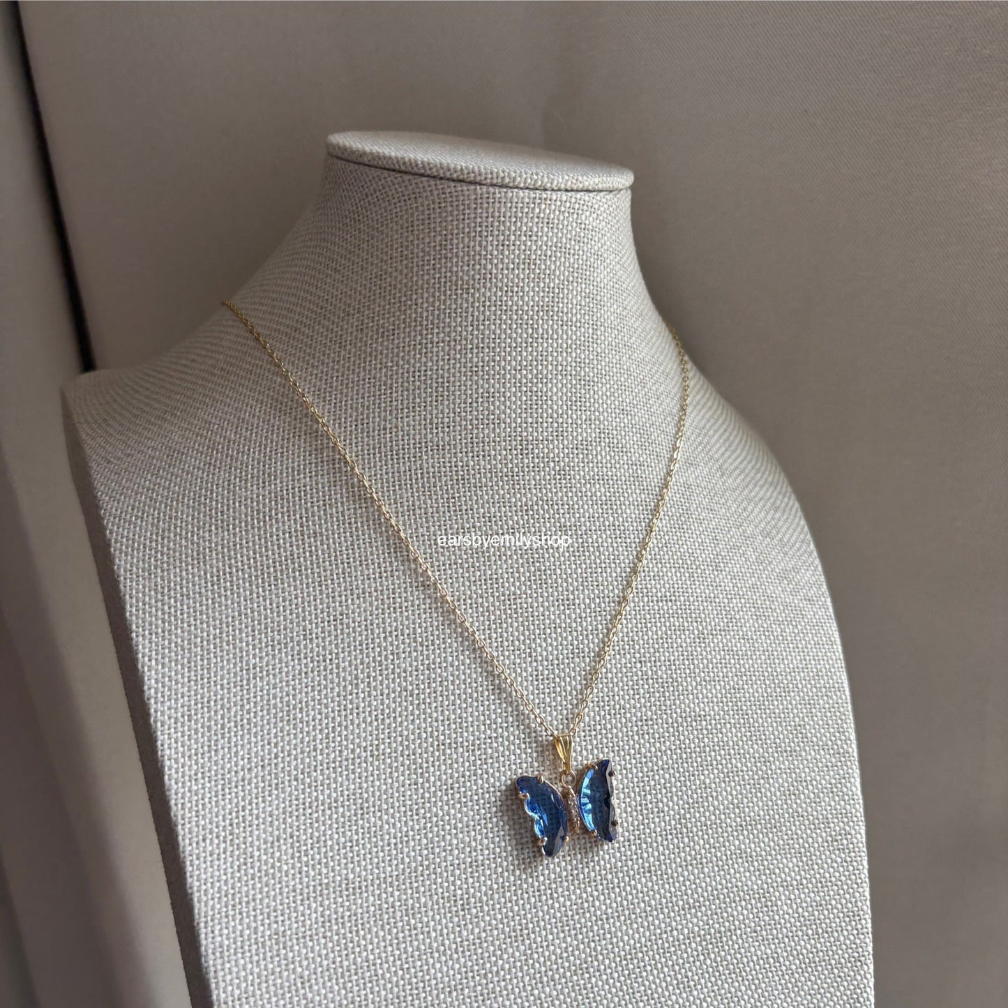 Cool blue crystal glass butterfly gold necklace