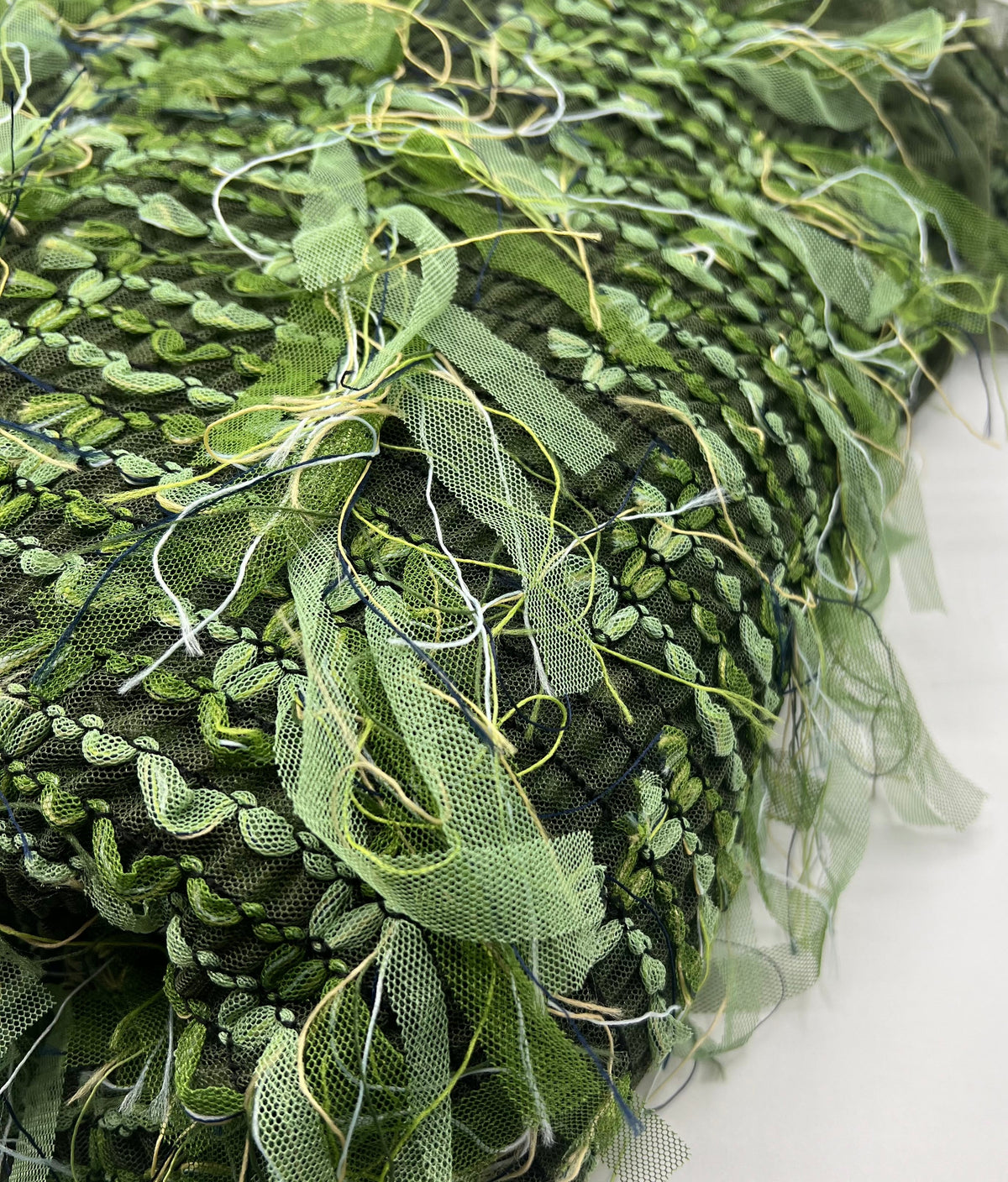 Green Mix Textured Mesh Tassel Fabric 2 Way Stretch
