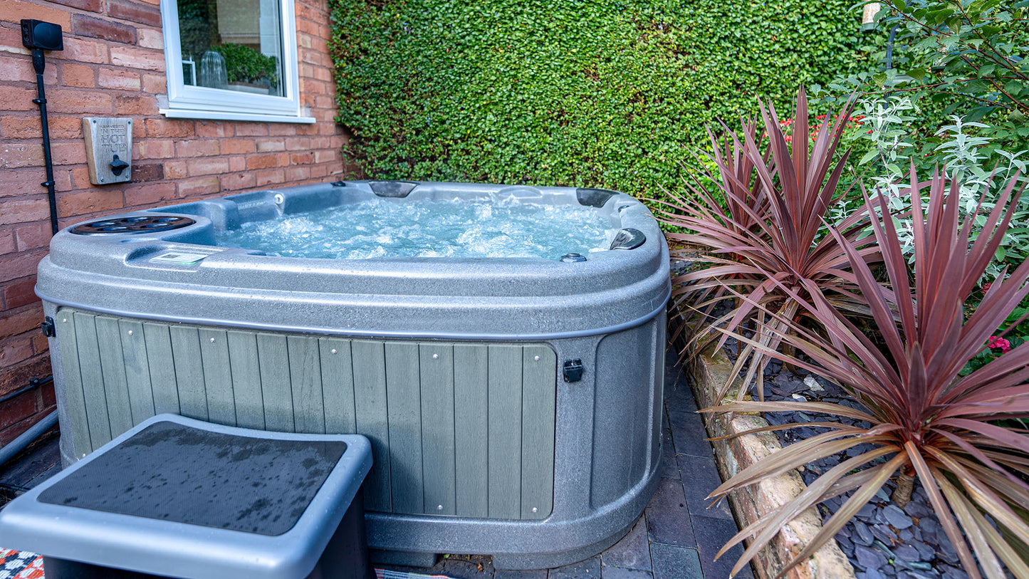 TheFoalyard RotoSpa DuraSpa S380 hot tub Granite Grey with Dark Grey panels 5 6 persons - side house easy install