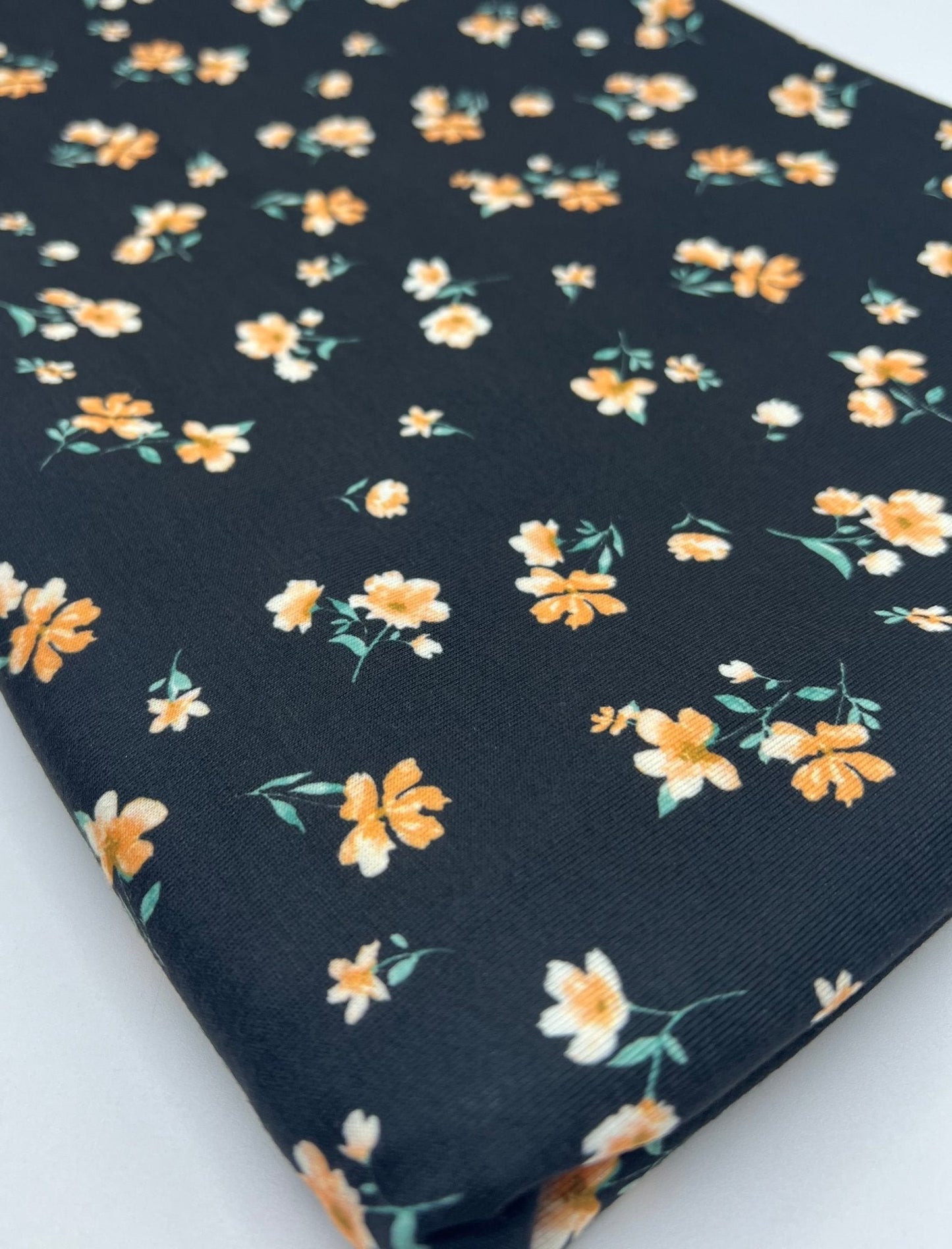 Black Orange Ditsy Floral Print Soft Spun Poly Stretch Fabric