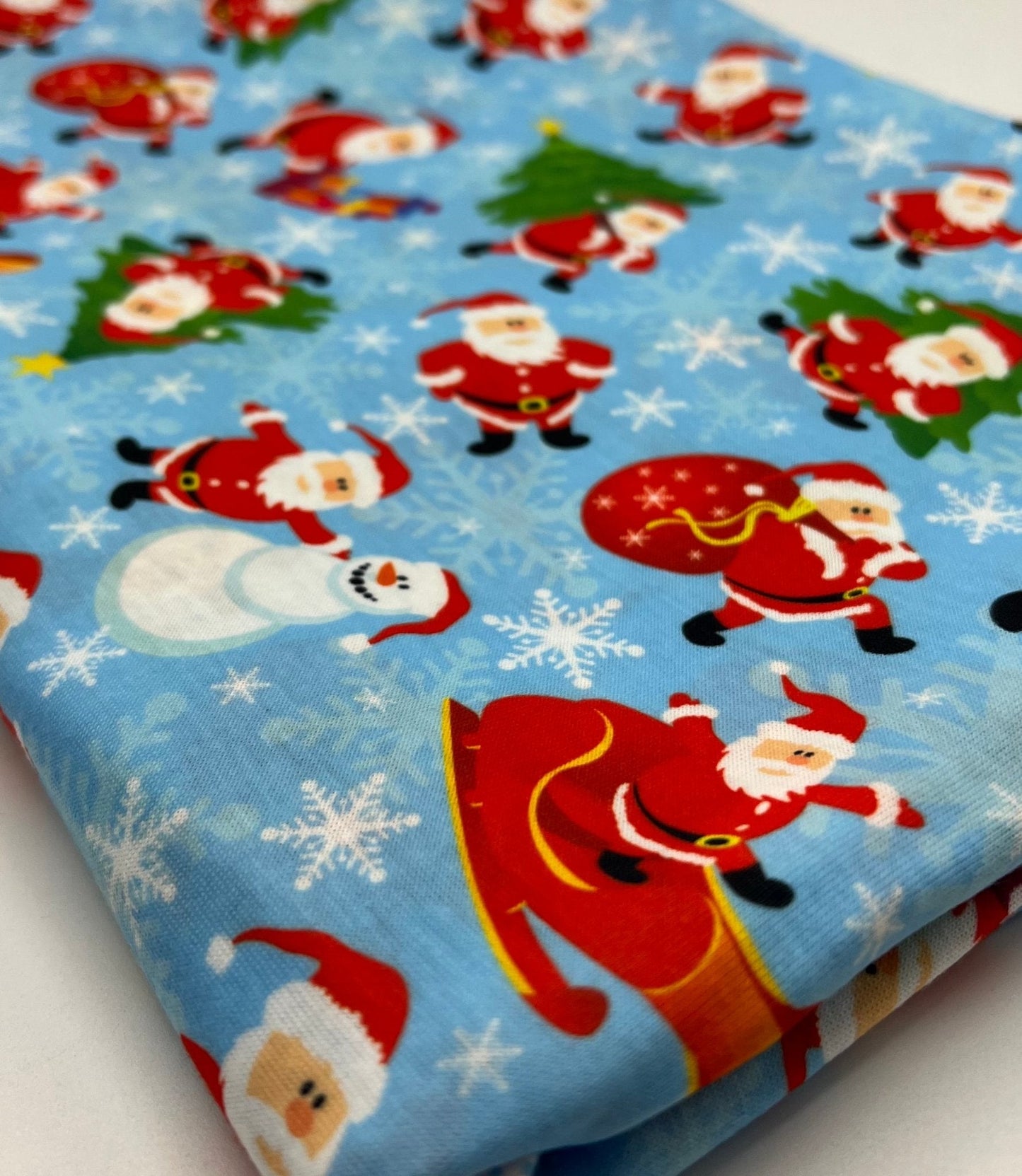 Blue Santa Sledge Print Soft Spun Poly Stretch Fabric