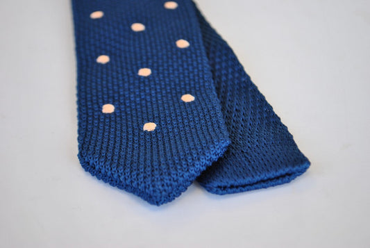 navy blue skinny knitted tie with pink polka dots with pointed end