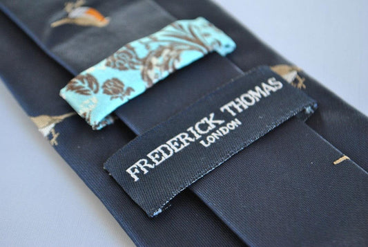 navy tie with embroidered robin design