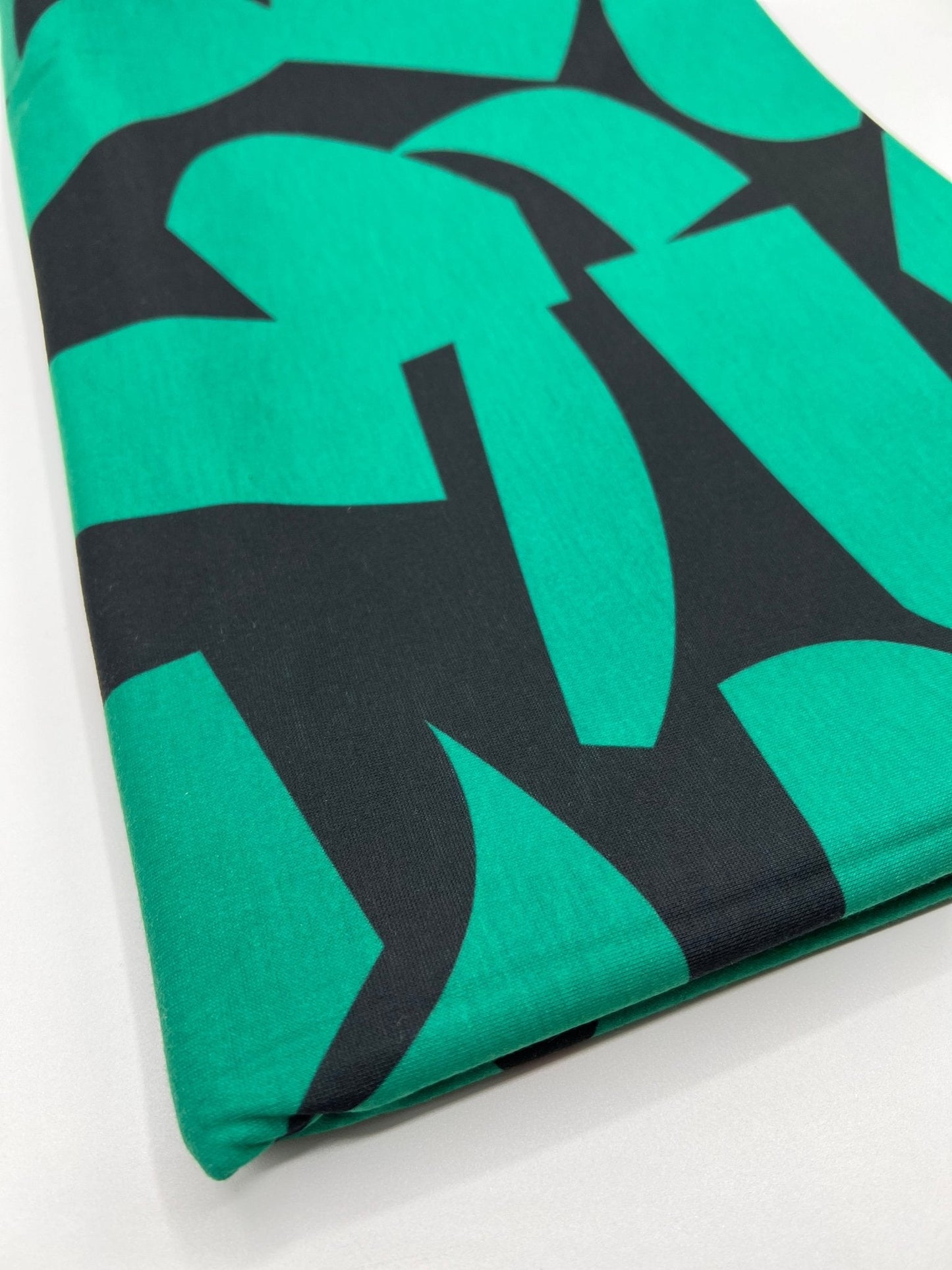 Green Black Spun Poly Stretch Fabric