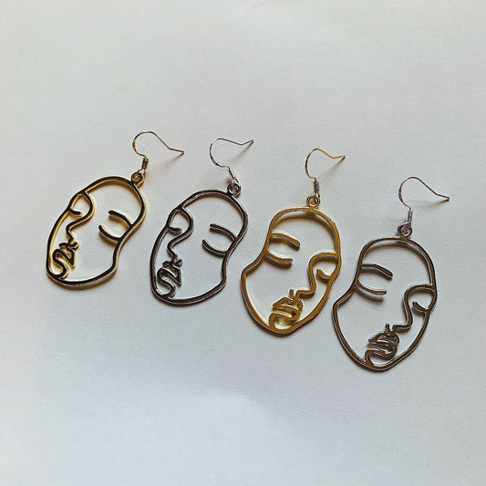 Silver or gold face outline earrings