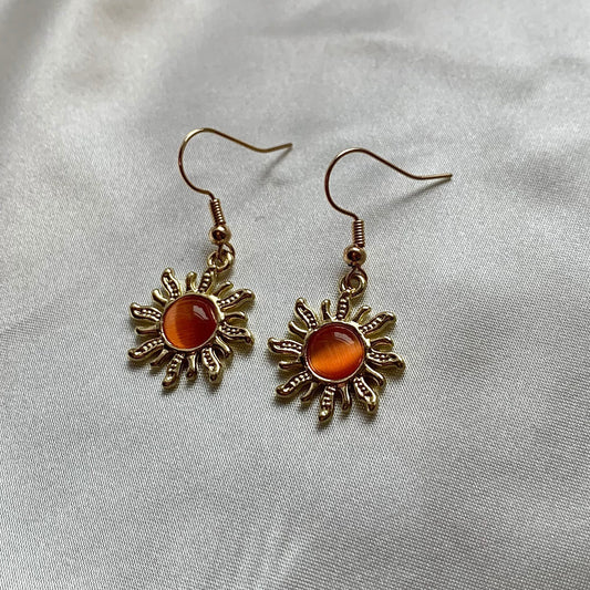 Cool quirky gold orange sun earrings with orange centre dangle earrings