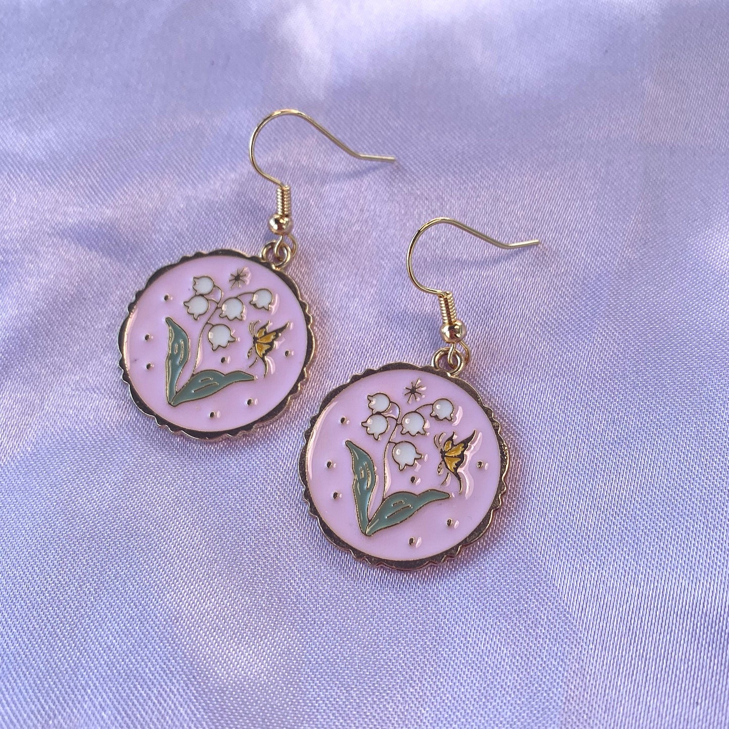 Pink circle with flowers and butterfly dangle gold earrings
