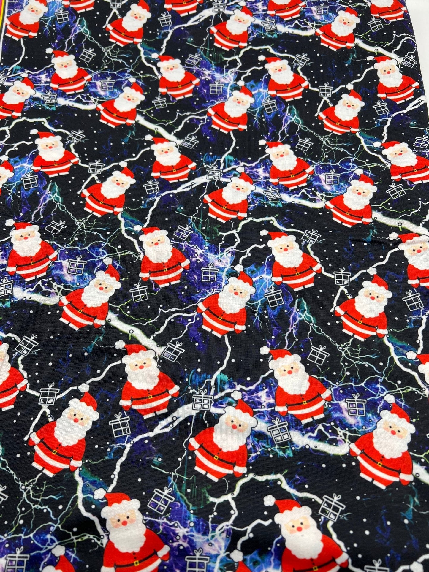 Lightning Santa Print Soft Spun Poly Stretch Fabric