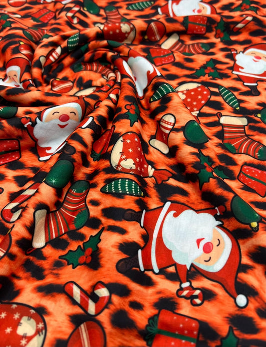 Orange Animal Santa Print Soft Spun Poly Stretch Fabric