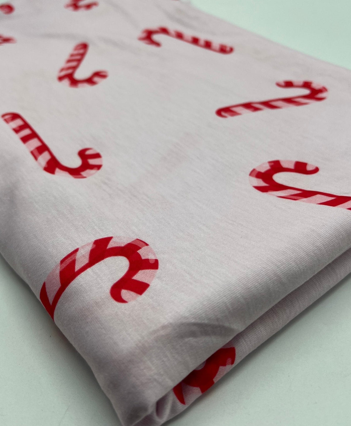 Soft Pink Candy Cane Print Soft Spun Poly Stretch Fabric