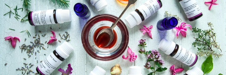Aromantic essential oils and natural skincare ingredients with herbs and flowers