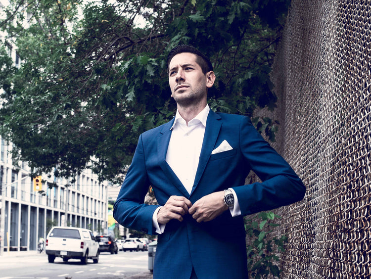 Man wearing a blue Pamoni suit and white shirt