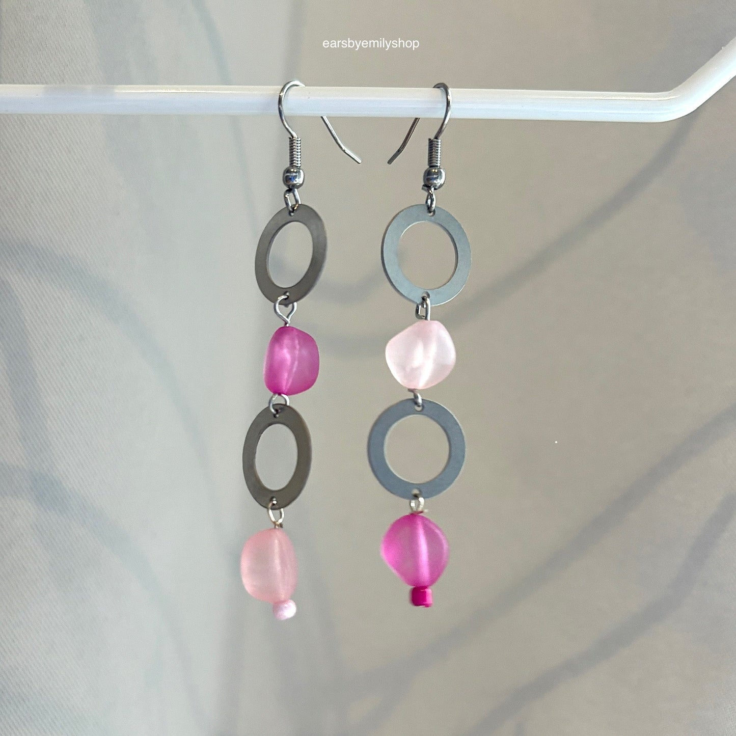 Stainless steel circle and asymmetrical pink bead statement dangle earrings