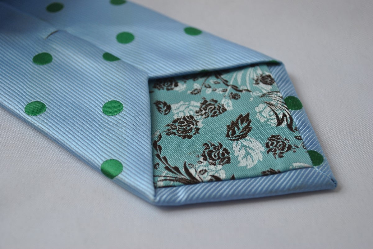 light blue tie with green polka dots