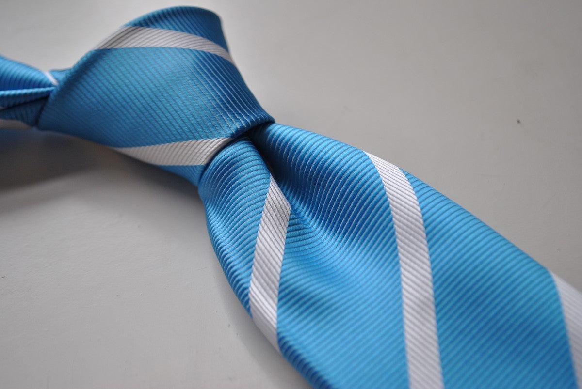 medium blue tie with white club stripes
