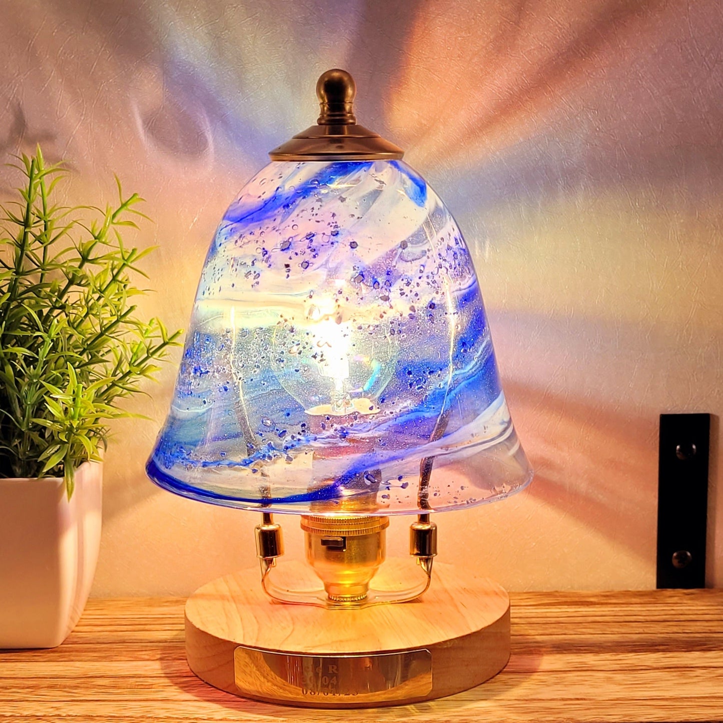 Ashes in glass table lamp