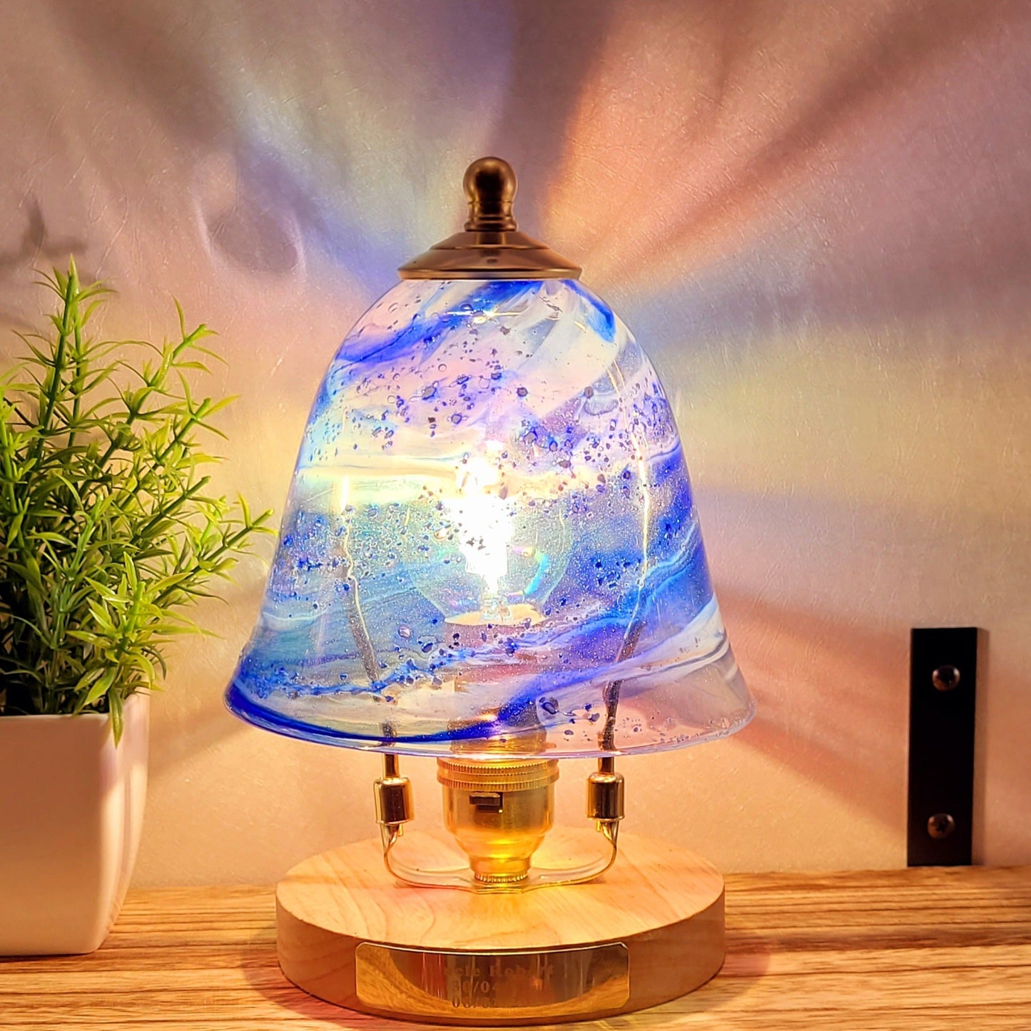 Ashes in glass table lamp