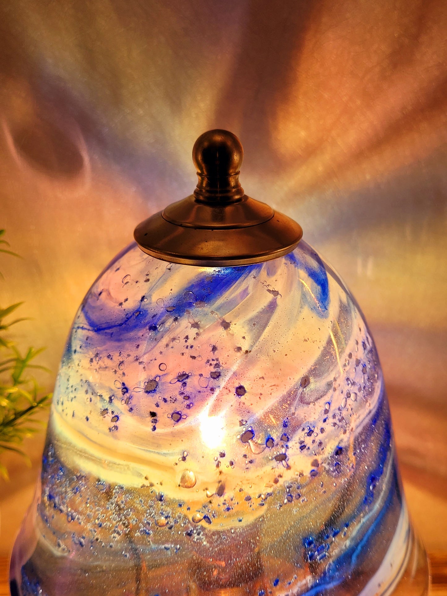 Ashes in glass table lamp
