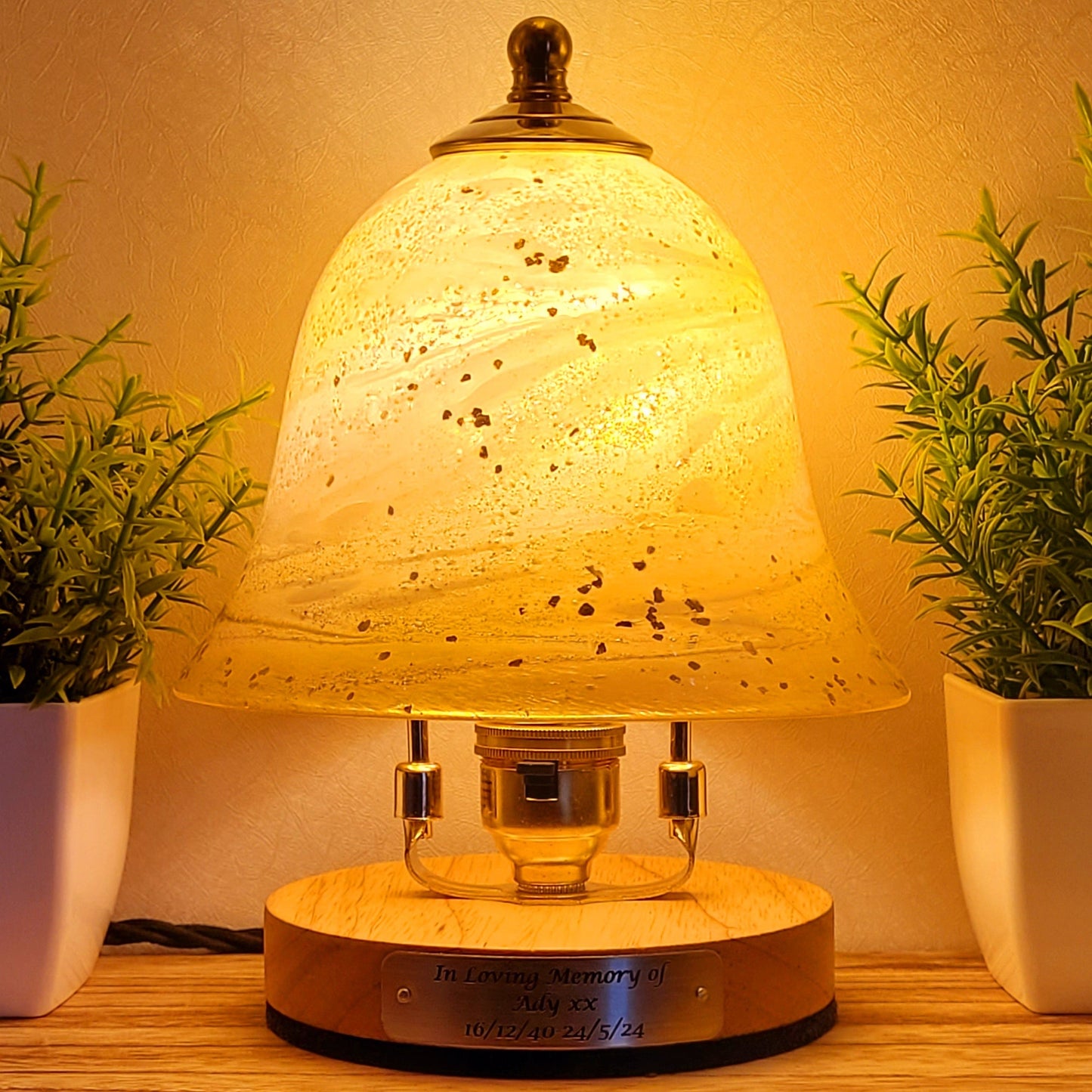 Ashes in glass table lamp