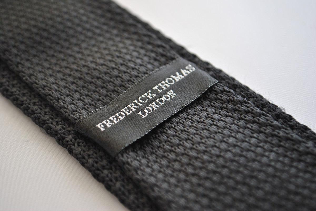 black skinny knitted tie with light blush pink polka dots