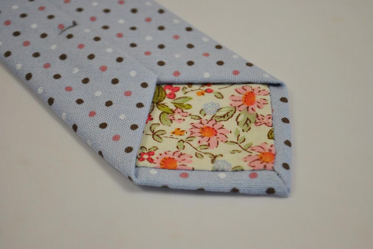 baby blue tie with brown, pink and white polka dots
