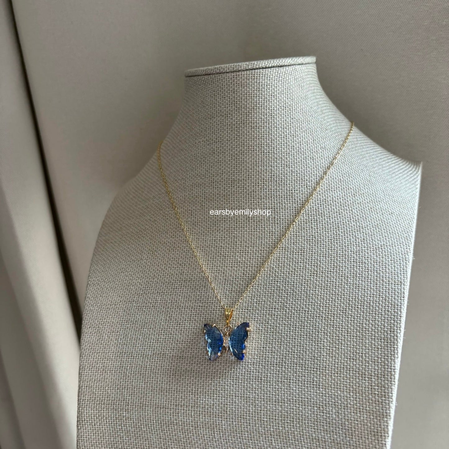 Cool blue crystal glass butterfly gold necklace