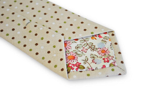 beige tie with green, red and white polka dots
