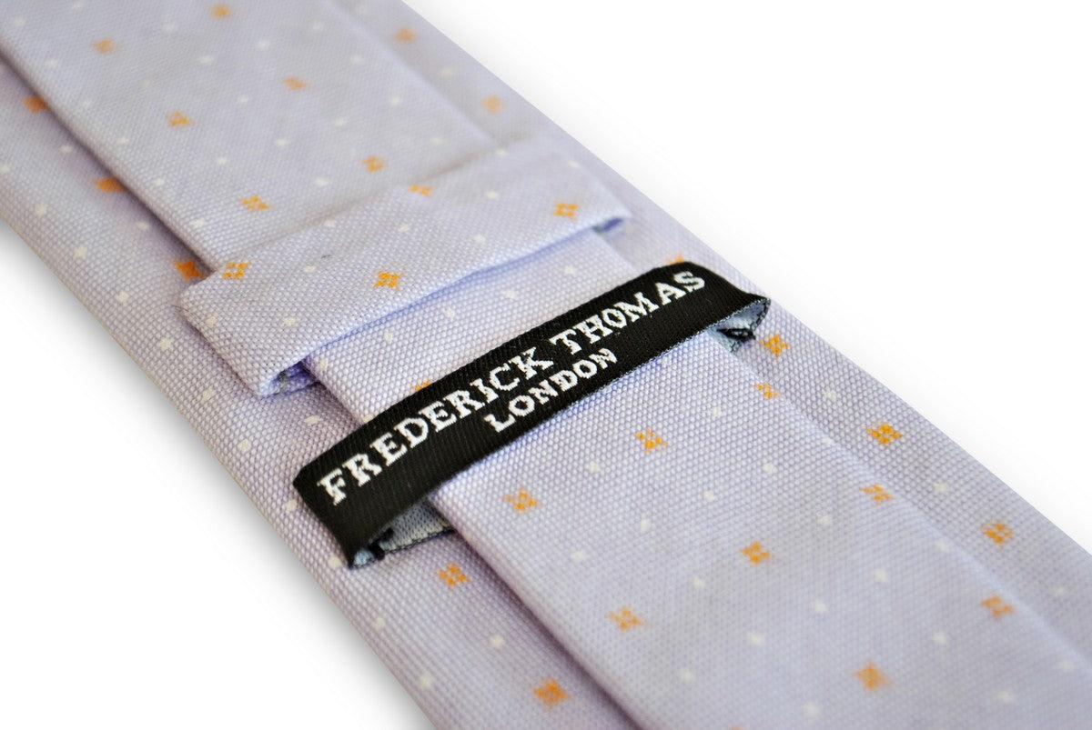 lilac tie with white and orange polka dots