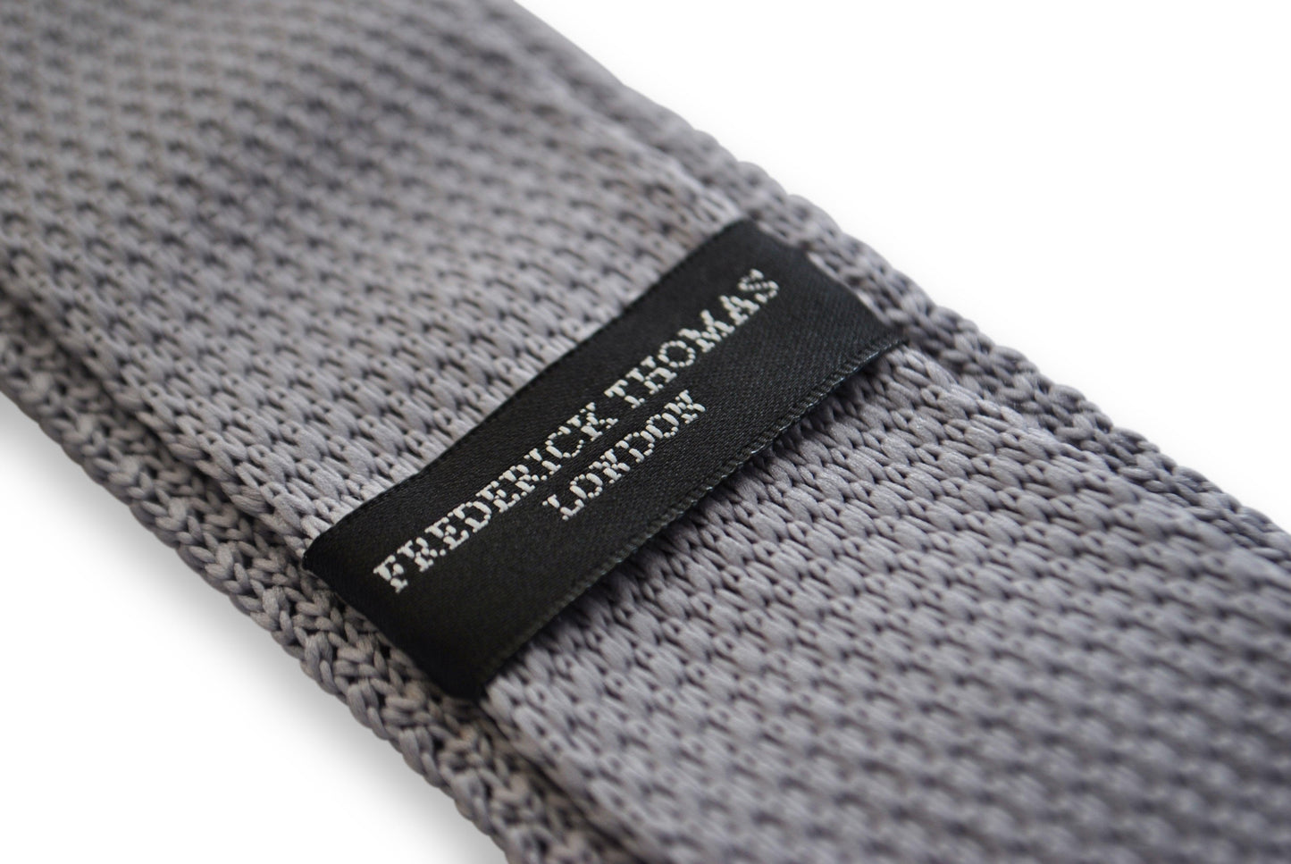 grey skinny knitted tie with pink polka dots