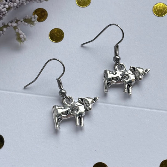 Silver cow earrings on hypoallergenic hooks