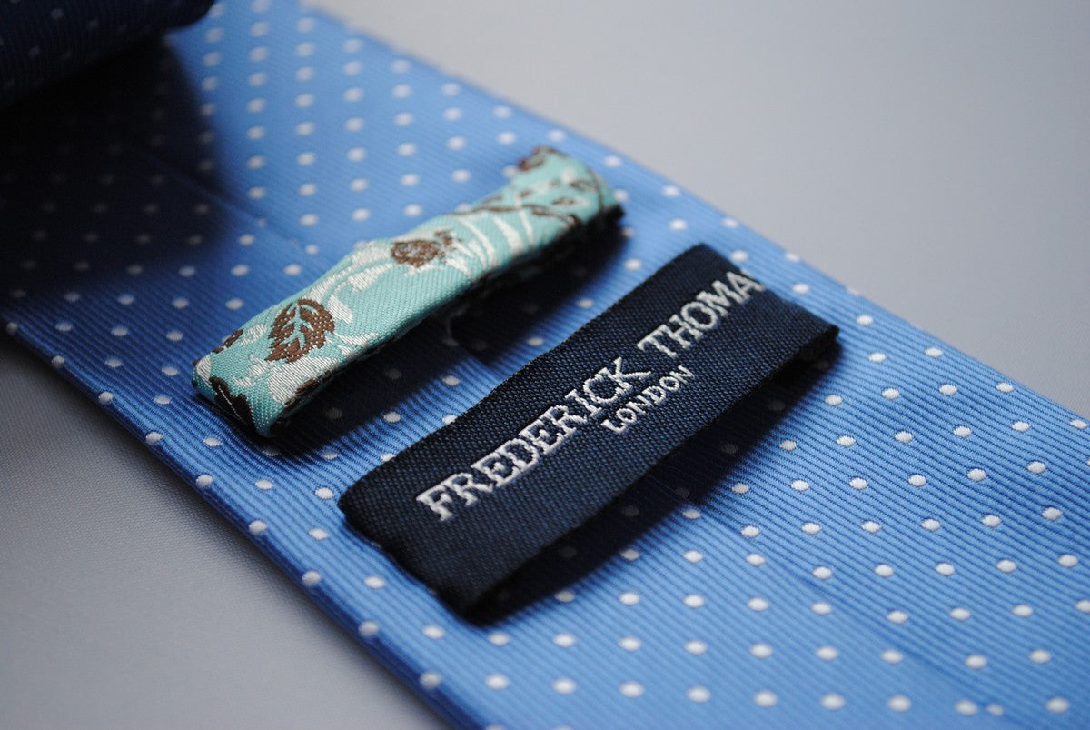 medium blue tie with white polka dots