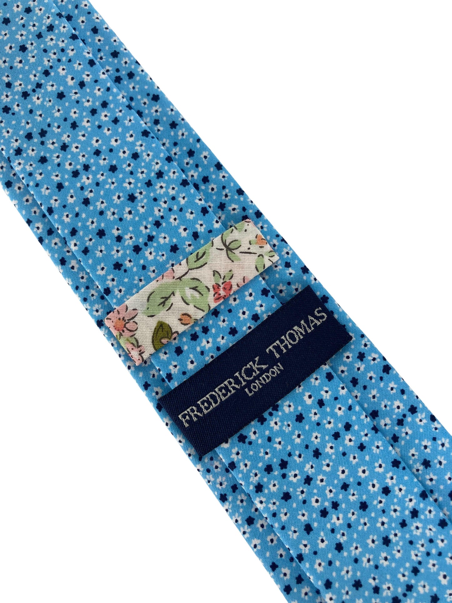 light pastel baby blue  cotton tie with ditsy navy & white floral print