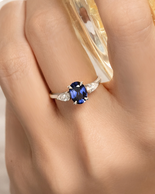 Blue Sapphire Oval Cut Three Stone Engagement Ring in Sterling Silver
