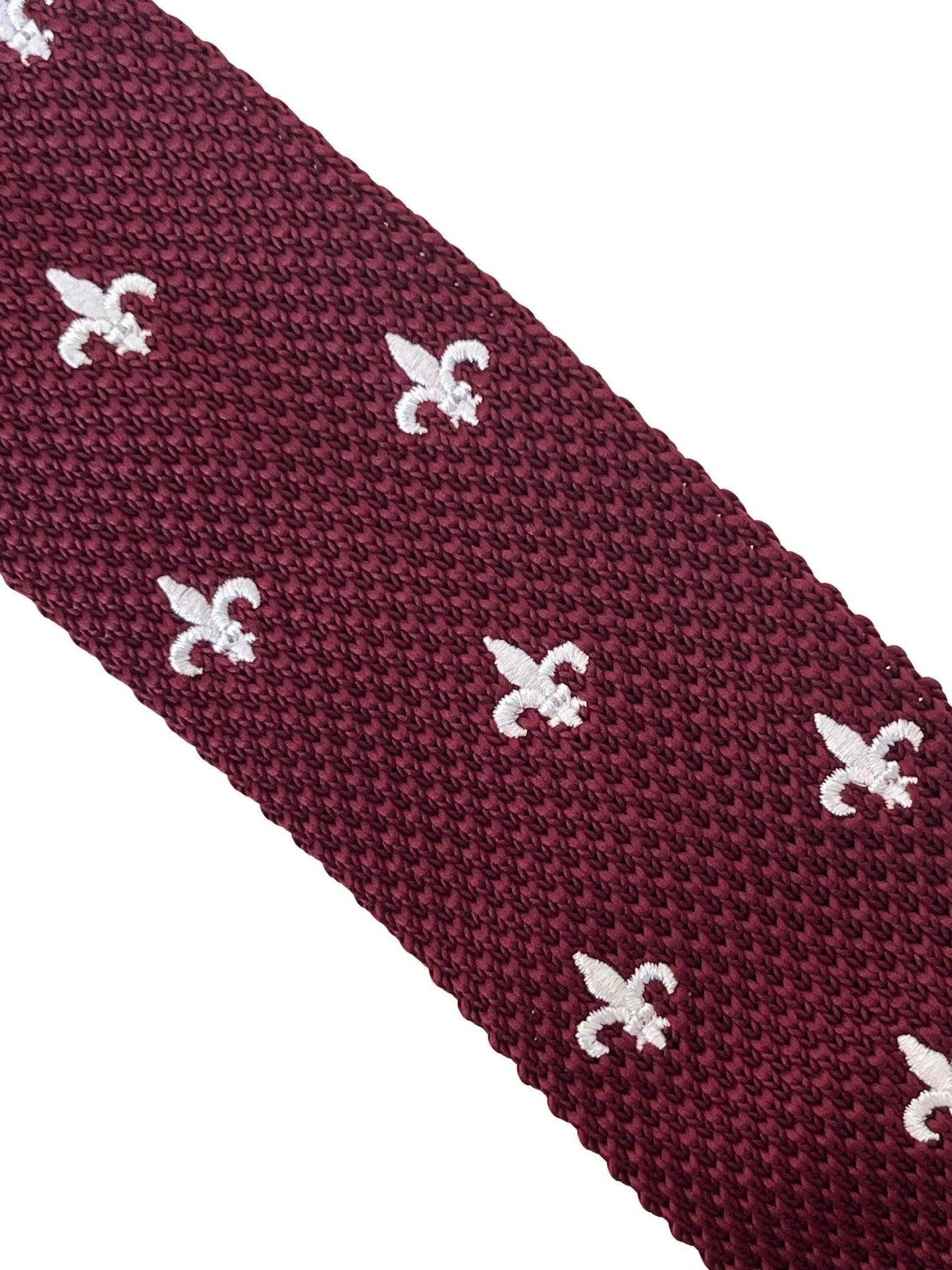maroon knitted tie with white embroidered fleur de lis lys design