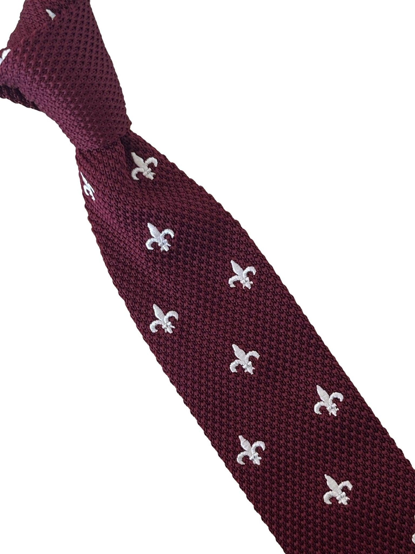 maroon knitted tie with white embroidered fleur de lis lys design