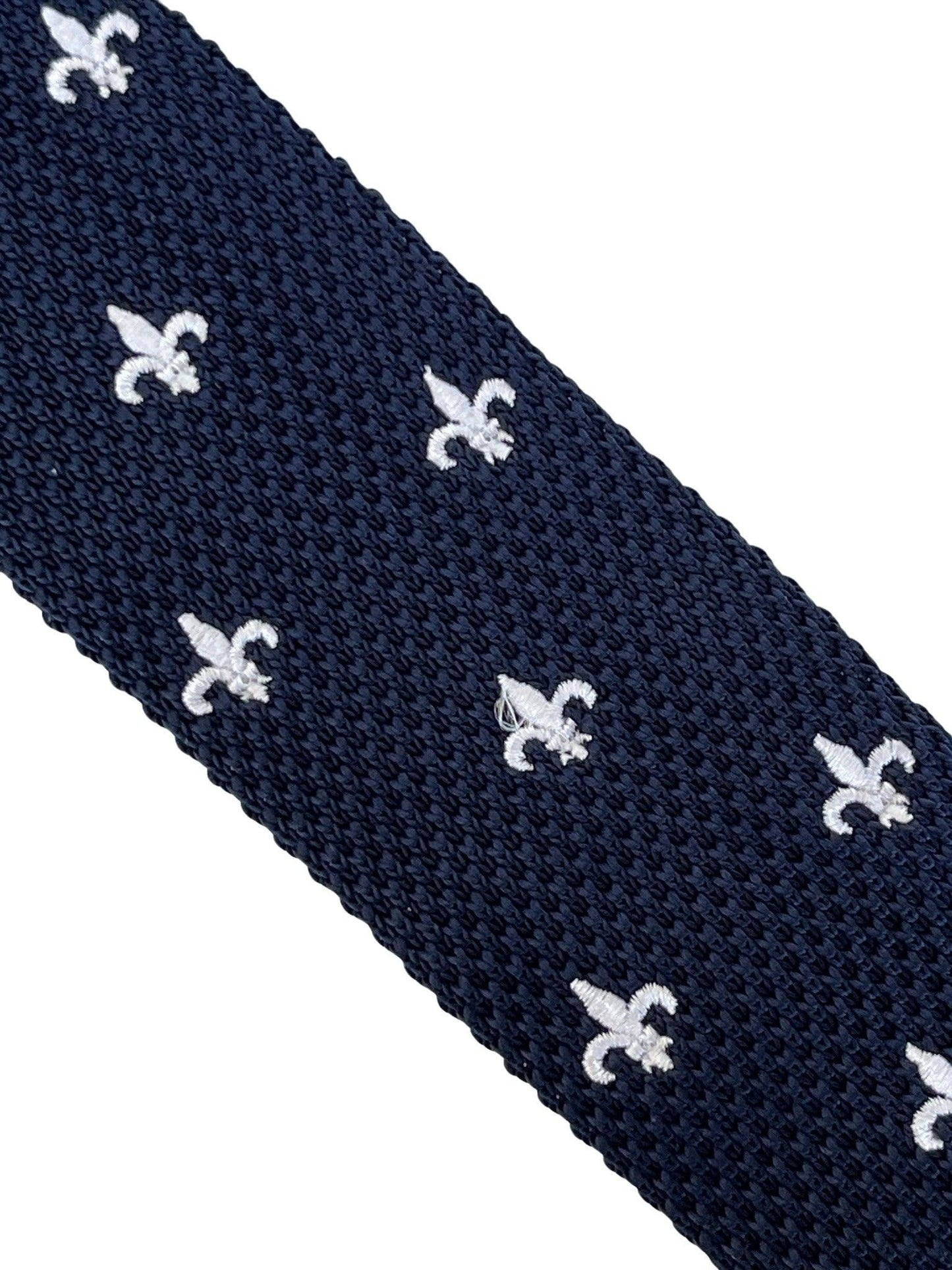 navy blue knitted tie with white embroidered fleur de lis lys design