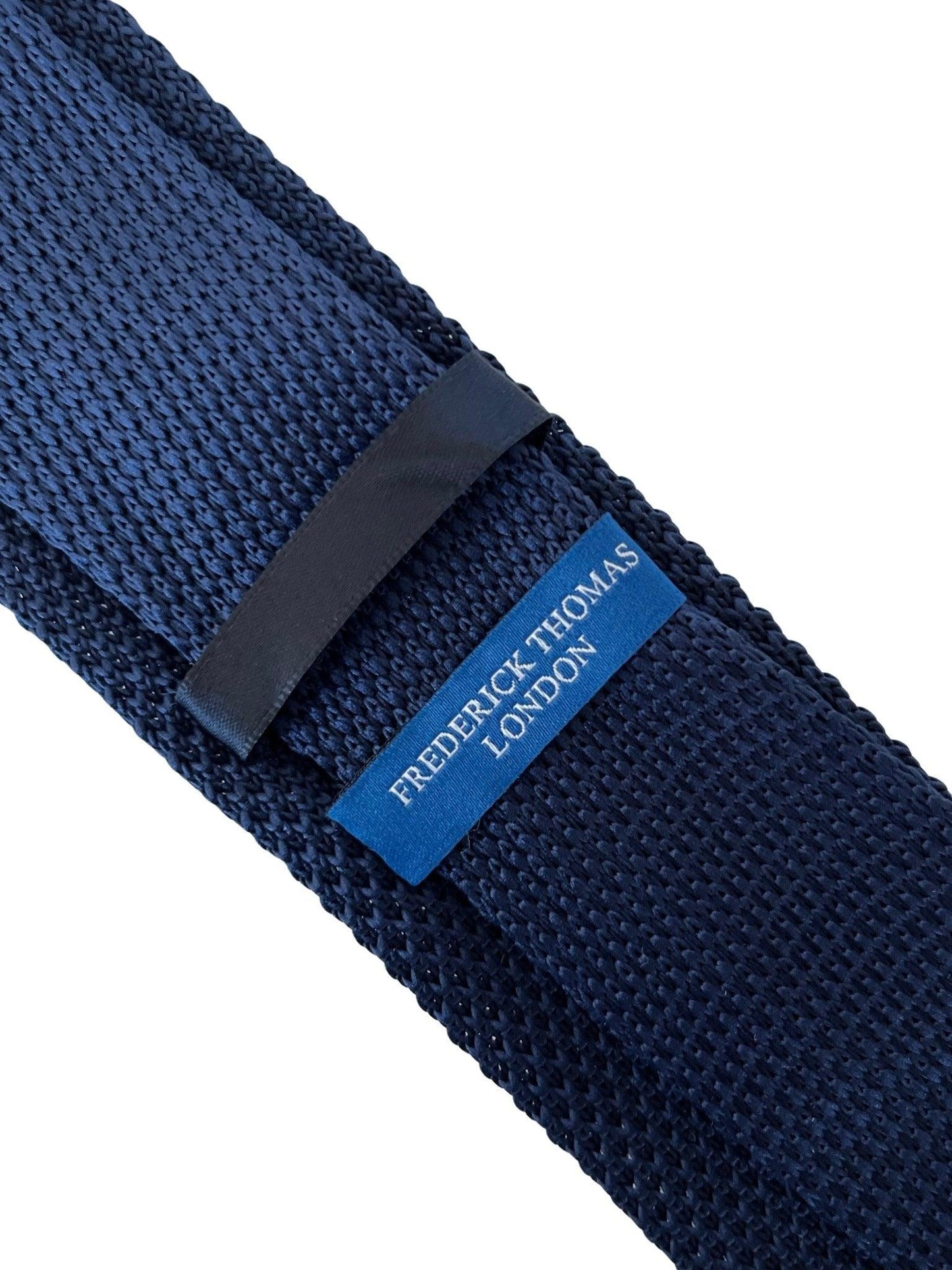 navy blue knitted tie with white embroidered bicycle bike design