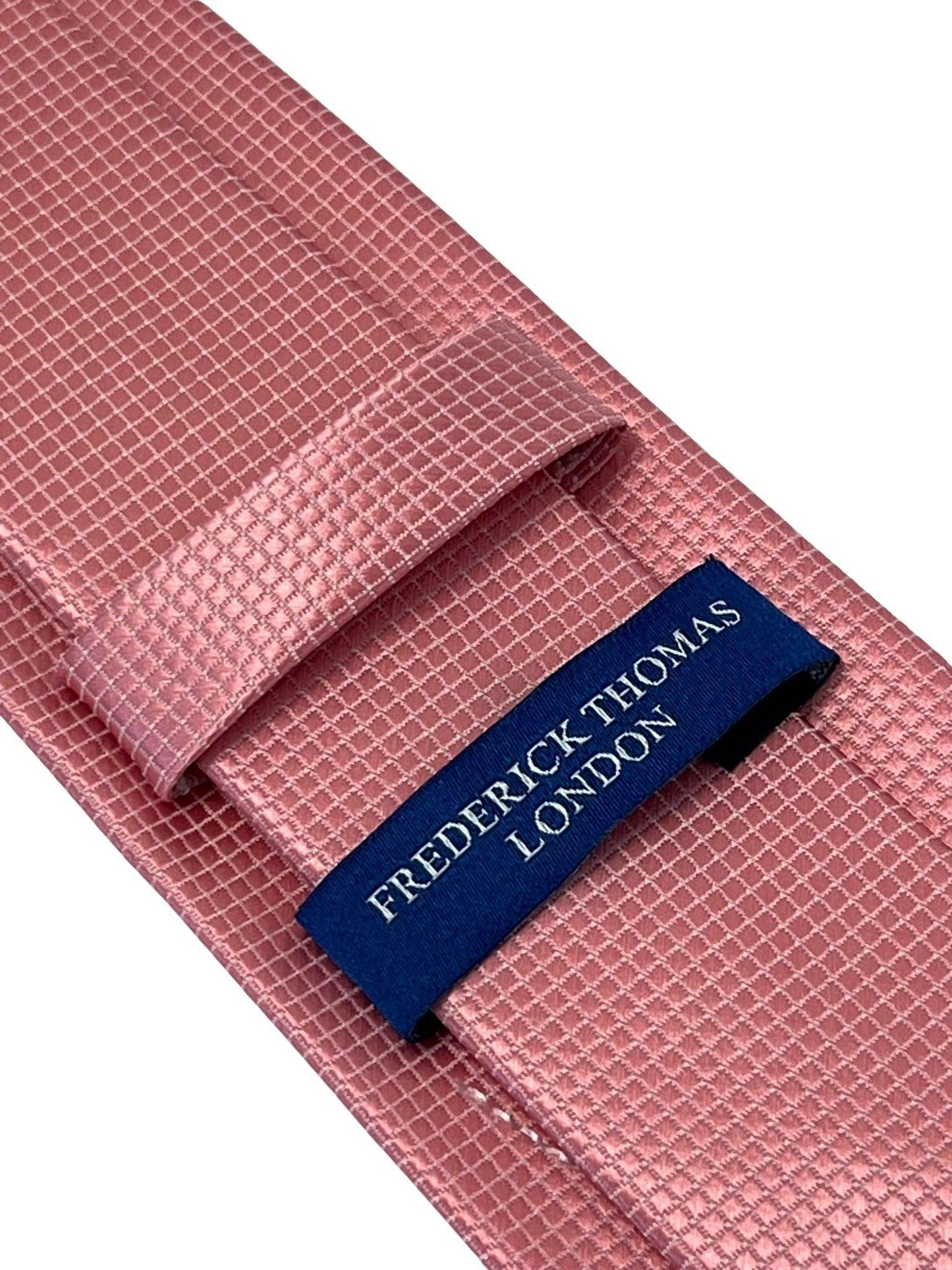 baby light pink tie with subtle squared pattern
