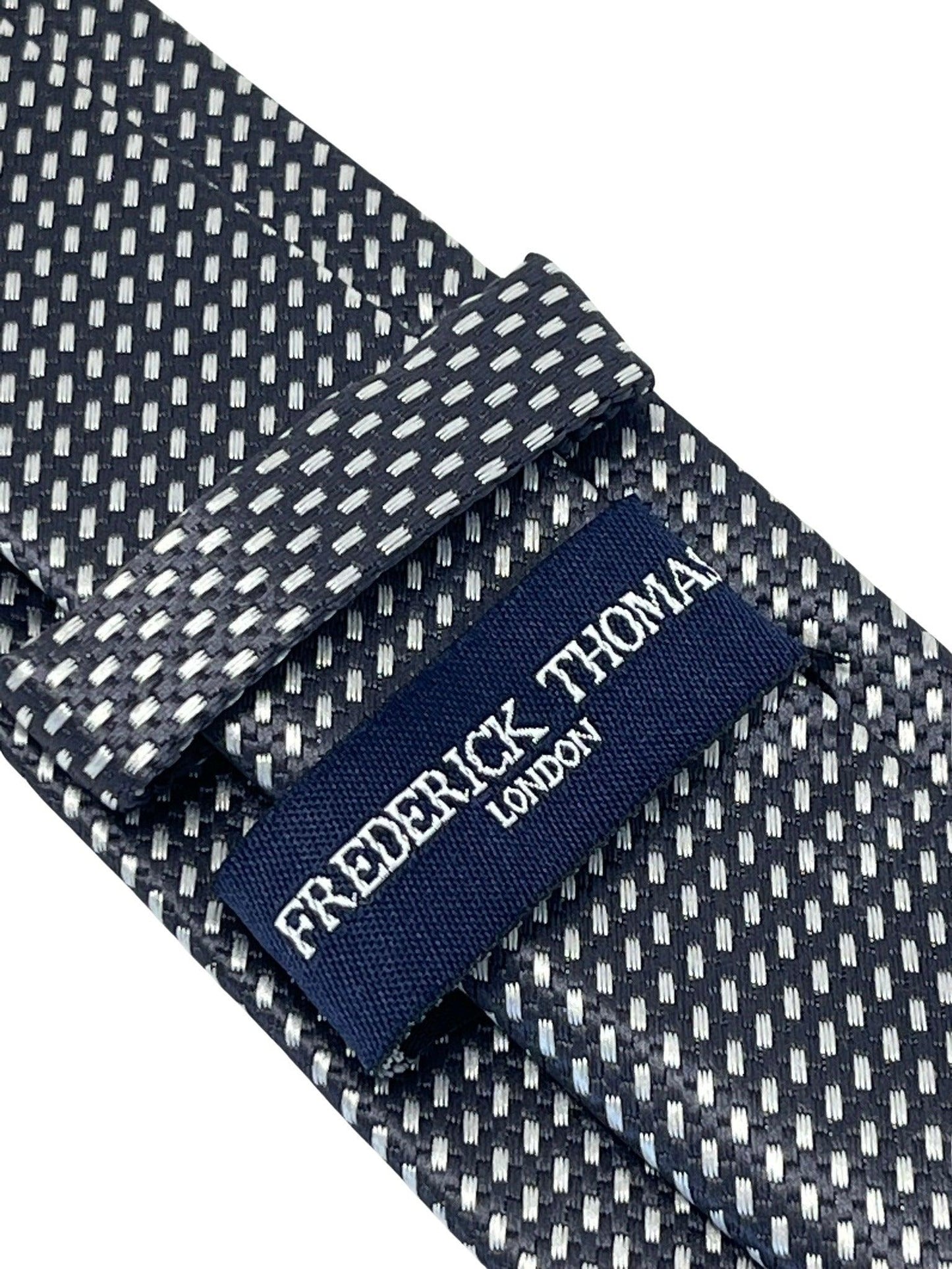 dark grey and white geometric stitch design