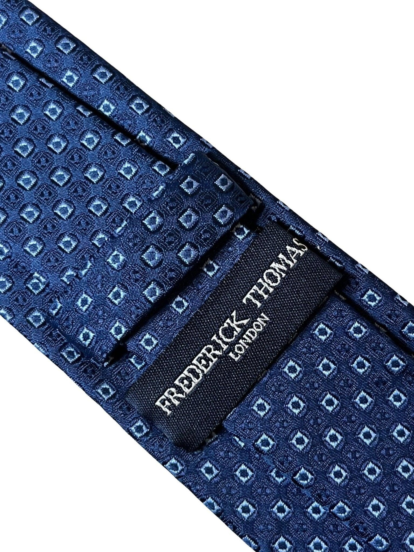 dark blue navy tie with square spotted design
