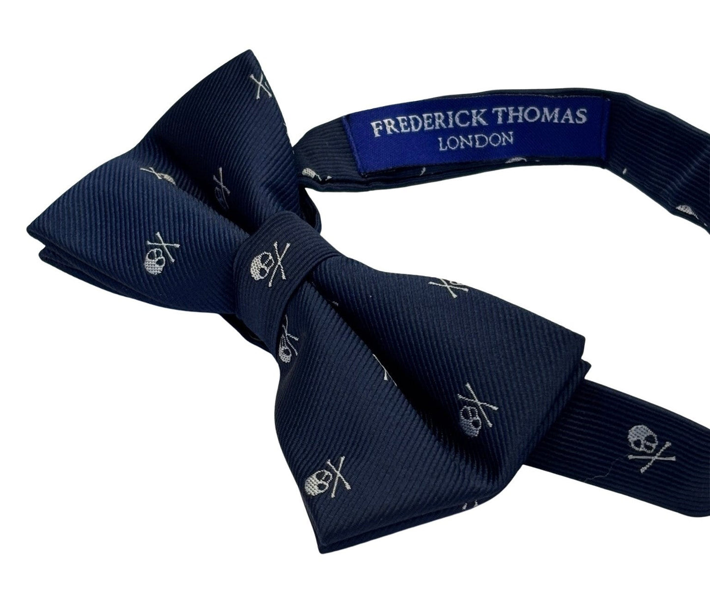 matching navy bow tie and pocket square with white skull and crossbone design