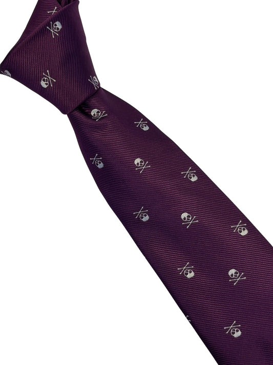 matching purple tie and pocket square with white skull and crossbone design