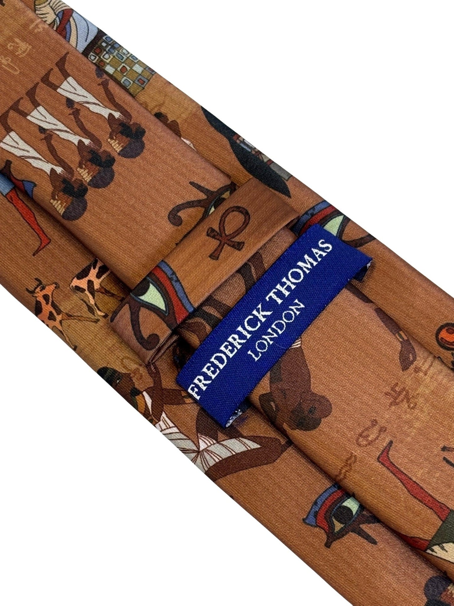 golden light brown tie with Egyptian hieroglyphics design