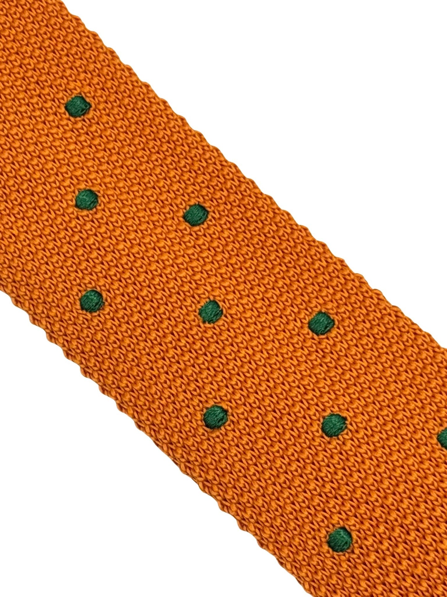 knitted tie in  bright orange with emerald green polka dots