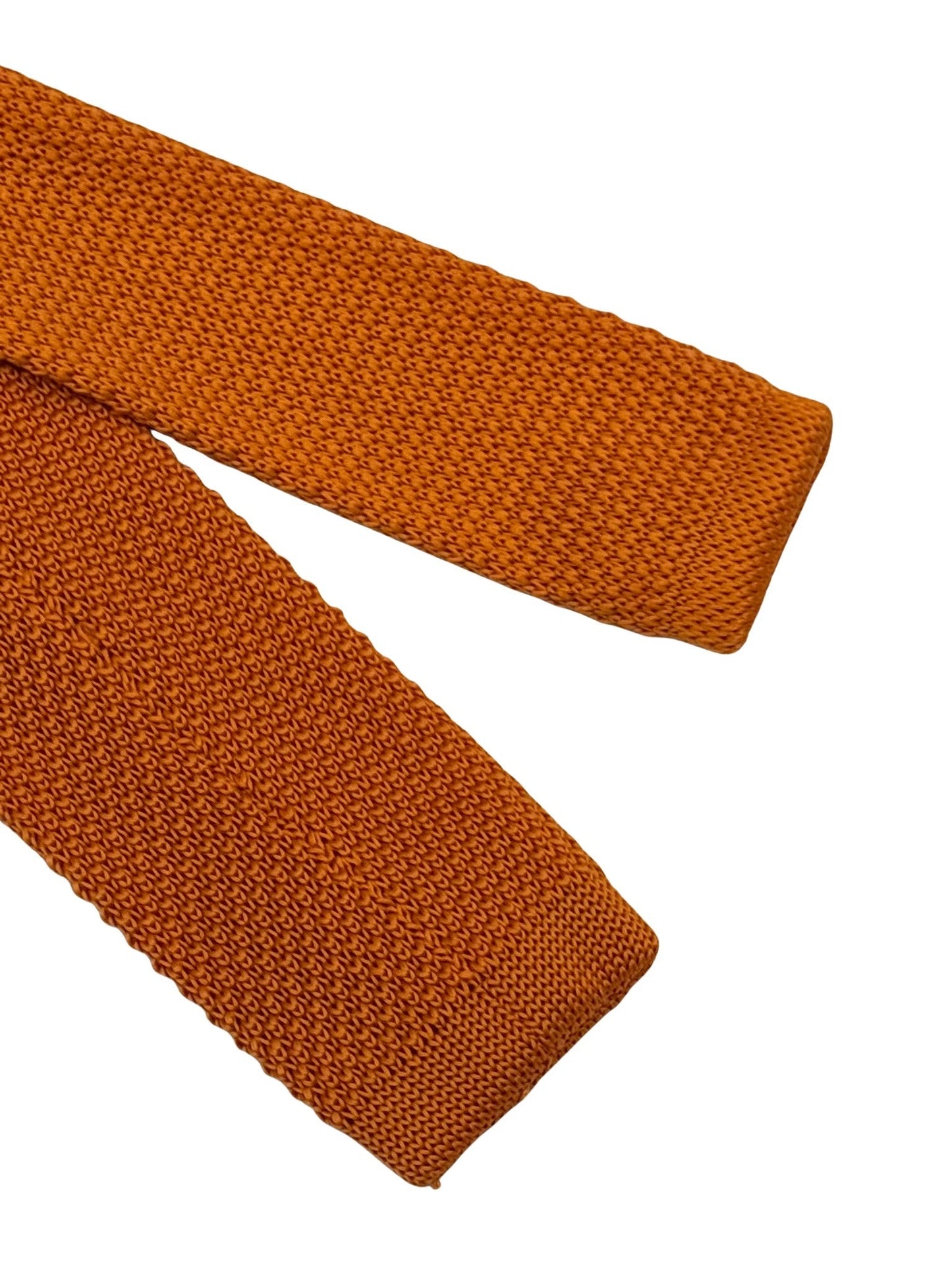 knitted tie in  bright orange with emerald green polka dots